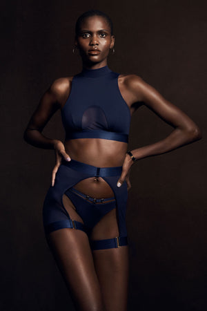 Bordelle Rey thong gstring mesh and jersey, Rey ouvert garter brief open back short with adjustable waist and thigh straps, Rey crop top in navy blue - lookbook image with model