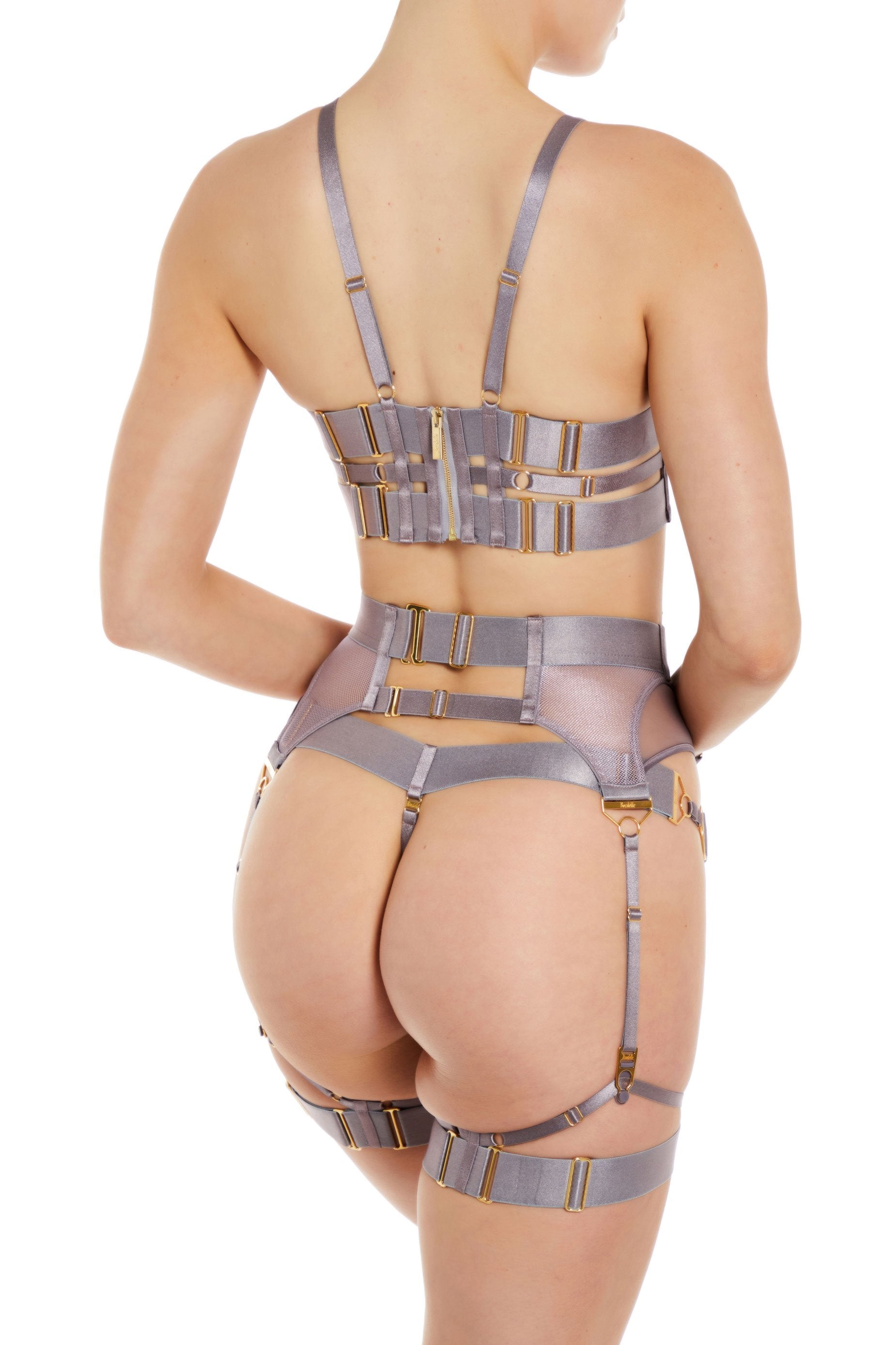 Bordelle Ula suspender and Ula bodice bra and Ula thong tundra violet foiled sheer mesh and grid mesh statement garter belt with four straps and large 24k gold plated o ring detail at front - back view 
