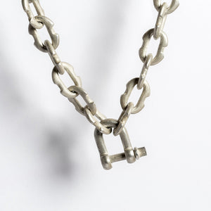 Parts of 4 Deco link charm chain choker in acid silver u-bolt closure - close up detail image